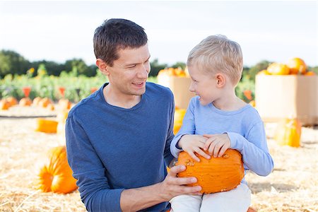 simsearch:400-07916492,k - family of two having fun at pumpkin patch together Stock Photo - Budget Royalty-Free & Subscription, Code: 400-08053072