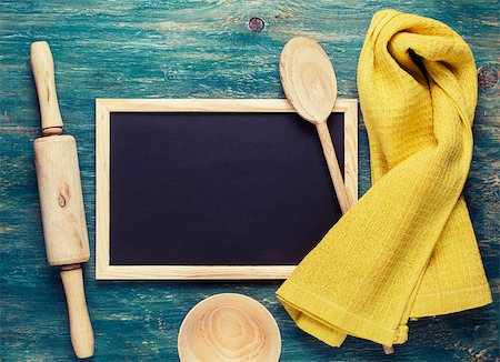 Kitchen tools. Yellow towel, wooden spoon, rolling pin and small blackboard Stock Photo - Budget Royalty-Free & Subscription, Code: 400-08053545