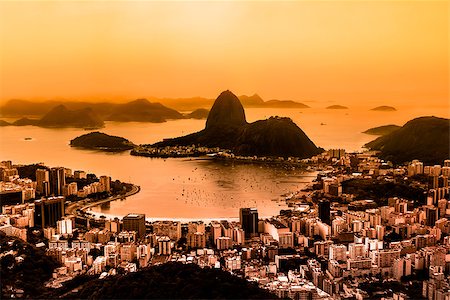 simsearch:400-08074208,k - Rio de Janeiro, Brazil. Suggar Loaf and  Botafogo beach viewed from Corcovado at sunset. Rio de Janeiro is the 2016 summer olympic games hosting city. Photographie de stock - Aubaine LD & Abonnement, Code: 400-08074208