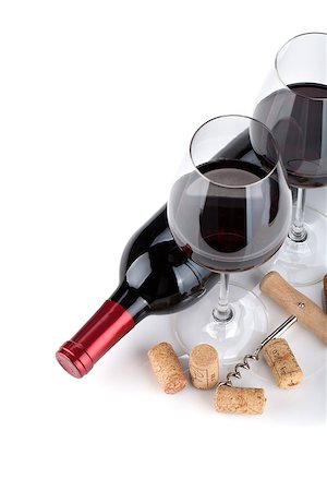 simsearch:400-06796159,k - Red wine glasses, bottle and corks. Closeup. Isolated on white background Stock Photo - Budget Royalty-Free & Subscription, Code: 400-08074258