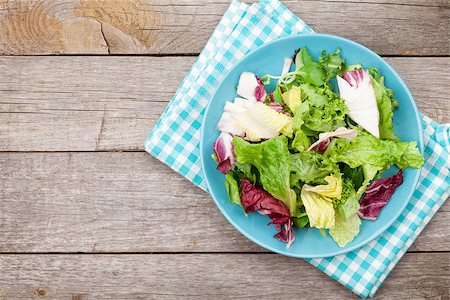 simsearch:400-06485512,k - Fresh healthy salad on wooden table with copy space Stock Photo - Budget Royalty-Free & Subscription, Code: 400-08074251