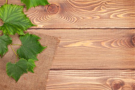 simsearch:400-08110621,k - Grape vine over wooden table background with copy space Stock Photo - Budget Royalty-Free & Subscription, Code: 400-08074278