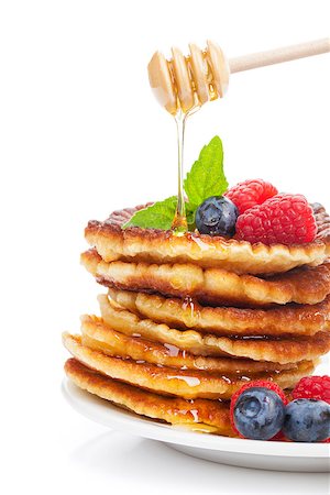 simsearch:400-09019412,k - Pancakes with raspberry, blueberry, mint and honey syrup. Isolated on white background Foto de stock - Super Valor sin royalties y Suscripción, Código: 400-08074272