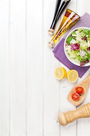 simsearch:400-06485512,k - Fresh healthy salad and condiments over white wooden table. View from above with copy space Stock Photo - Budget Royalty-Free & Subscription, Code: 400-08074314