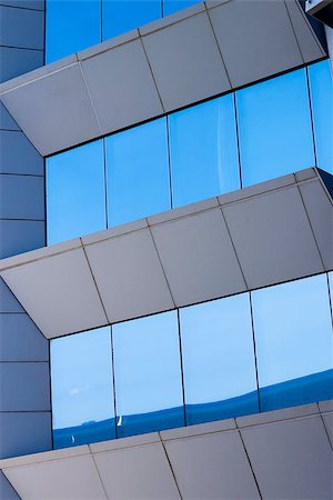 photojope (artist) - The ocean reflected in the glass of a modern building window like a mirror. Fotografie stock - Microstock e Abbonamento, Codice: 400-08074357