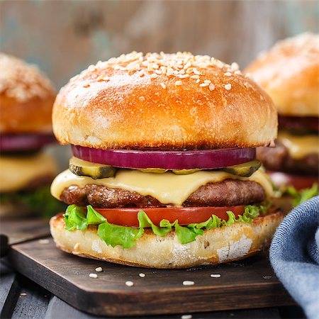 Delicious burger with beef, bacon, cheese and vegetables Stock Photo - Budget Royalty-Free & Subscription, Code: 400-08074545