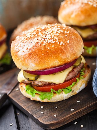 Delicious burger with beef, bacon, cheese and vegetables Stock Photo - Budget Royalty-Free & Subscription, Code: 400-08074546