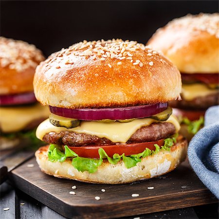 Delicious burger with beef, bacon, cheese and vegetables Stock Photo - Budget Royalty-Free & Subscription, Code: 400-08074548