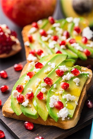 sandwich with avocado - Delicious avocado sandwich with feta and pomegranate Stock Photo - Budget Royalty-Free & Subscription, Code: 400-08074549