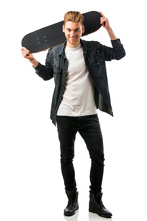 Studio portrait of a young man posing with a skateboard Stock Photo - Budget Royalty-Free & Subscription, Code: 400-08074619