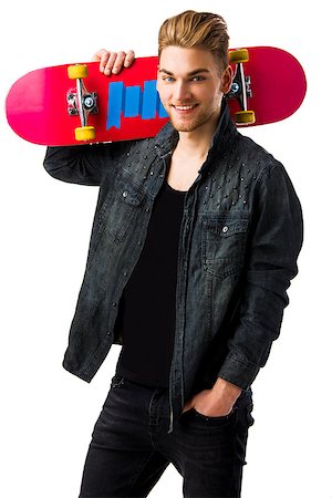 Studio portrait of a young man posing with a skateboard Stock Photo - Budget Royalty-Free & Subscription, Code: 400-08074624