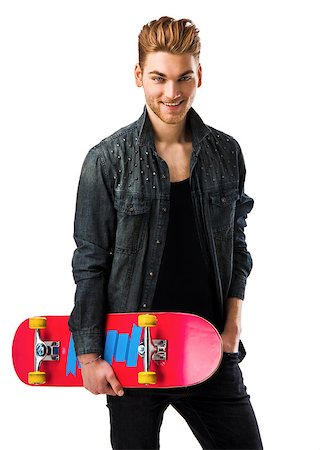 Studio portrait of a young man posing with a skateboard Stock Photo - Budget Royalty-Free & Subscription, Code: 400-08074623