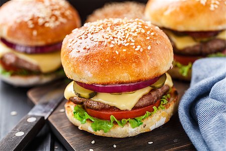 Delicious burger with beef, bacon, cheese and vegetables Stock Photo - Budget Royalty-Free & Subscription, Code: 400-08074686