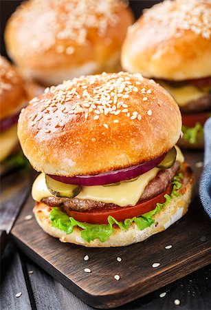 Delicious burger with beef, bacon, cheese and vegetables Stock Photo - Budget Royalty-Free & Subscription, Code: 400-08074687