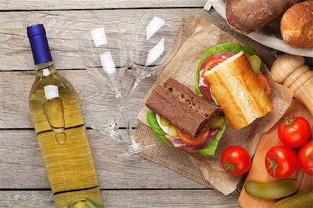simsearch:400-07099478,k - Sandwiches and white wine on wooden table. Top view Stock Photo - Budget Royalty-Free & Subscription, Code: 400-08074759