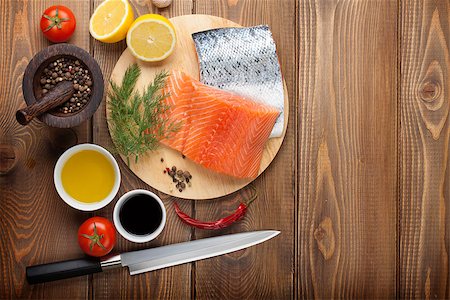 simsearch:400-08187570,k - Salmon and spices on wooden table. Top view with copy space Stockbilder - Microstock & Abonnement, Bildnummer: 400-08074766