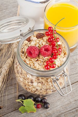 porridge and berries - Healty breakfast with muesli, berries and orange juice. On wooden table Stock Photo - Budget Royalty-Free & Subscription, Code: 400-08074786