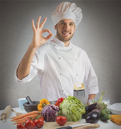 simsearch:400-08254392,k - Confident and expert chef promotes his cuisine Foto de stock - Super Valor sin royalties y Suscripción, Código: 400-08074865