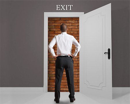Businessman in front of an exit hampered Stock Photo - Budget Royalty-Free & Subscription, Code: 400-08074885