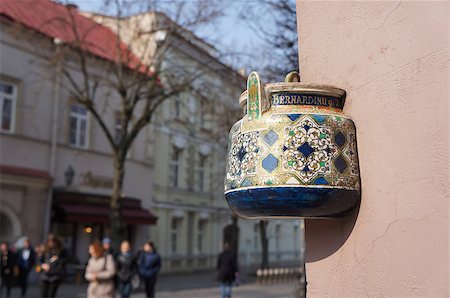 embedded - Ancient teapot embedded in facade of old building in Vilnius, Lithuania. Inscription on the teapot is address of this building - Bernardine street 2. Stock Photo - Budget Royalty-Free & Subscription, Code: 400-08075017