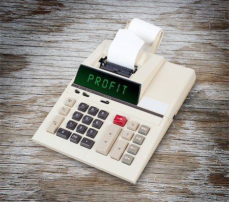 divide money - Old calculator showing a text on display - profit Stock Photo - Budget Royalty-Free & Subscription, Code: 400-08075148