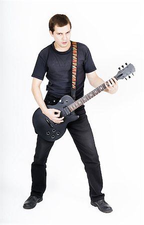 simsearch:400-08138723,k - Young man with a black electric guitar Stock Photo - Budget Royalty-Free & Subscription, Code: 400-08075204