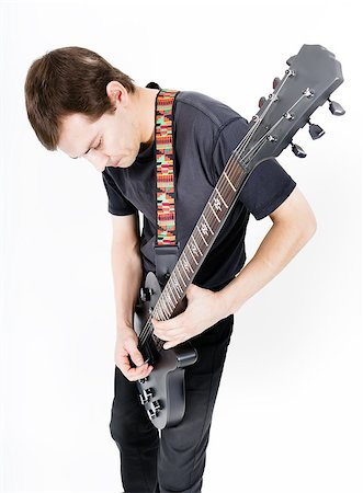 simsearch:400-08138723,k - Young man with a black electric guitar Stock Photo - Budget Royalty-Free & Subscription, Code: 400-08075203