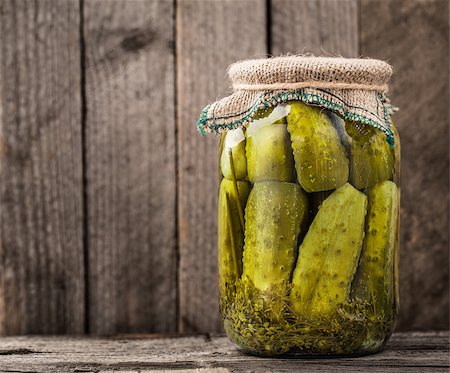 pickling gherkin - Jar of homemade pickles on a rustic wooden board Stock Photo - Budget Royalty-Free & Subscription, Code: 400-08075393