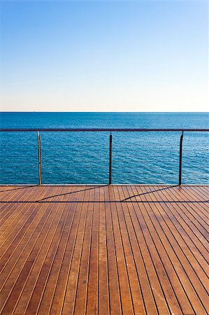 photojope (artist) - Empty ocean viewpoint plattform with wooden floor desk. Clear sky and blue sea in a sunny day of summer. Vertical composition. Fotografie stock - Microstock e Abbonamento, Codice: 400-08075412