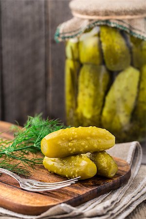 pickling gherkin - Homemade small pickles on a wooden board Stock Photo - Budget Royalty-Free & Subscription, Code: 400-08075492