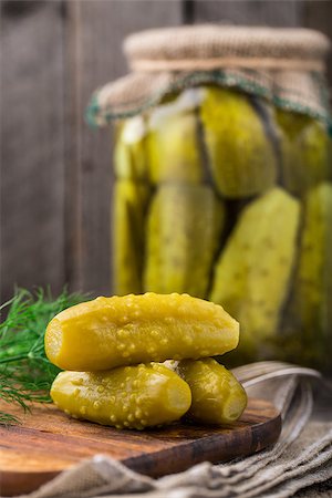 pickling gherkin - Homemade small pickles on a wooden board Stock Photo - Budget Royalty-Free & Subscription, Code: 400-08075593