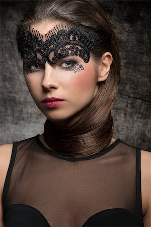 simsearch:400-04873499,k - Pretty, elegant, stunning brunette woman with nice hairstyle covered her neck and mask on the face. she has hot nice nark makeup. She is wearing half transparent top. Stock Photo - Budget Royalty-Free & Subscription, Code: 400-08076224
