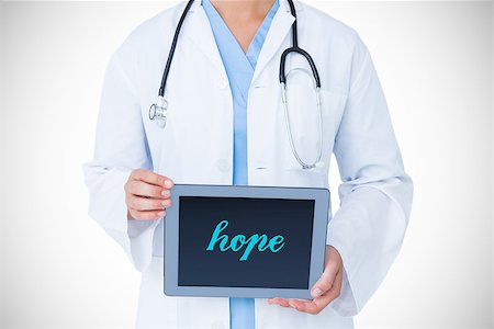 simsearch:400-06875998,k - The word hope against doctor showing tablet pc Photographie de stock - Aubaine LD & Abonnement, Code: 400-08076325