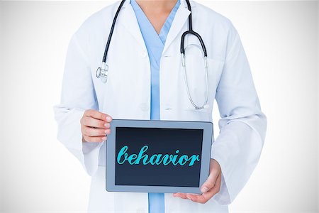 simsearch:400-06875998,k - The word behavior against doctor showing tablet pc Photographie de stock - Aubaine LD & Abonnement, Code: 400-08076331