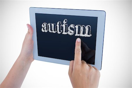 The word autism against woman using tablet pc Stock Photo - Budget Royalty-Free & Subscription, Code: 400-08076332