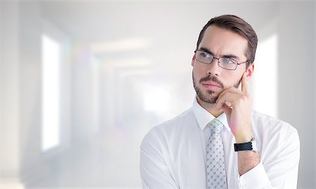 simsearch:400-08076534,k - Portrait of a businessman with glasses thinking  against digitally generated room Foto de stock - Royalty-Free Super Valor e Assinatura, Número: 400-08076401