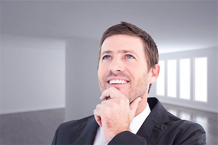 simsearch:400-08076534,k - Businessman smiling and thinking against bright room with wall in the middle Foto de stock - Royalty-Free Super Valor e Assinatura, Número: 400-08076495