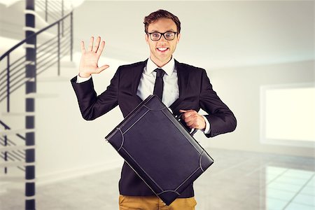 simsearch:400-08020381,k - Young geeky businessman holding briefcase against digitally generated room with winding stairs Fotografie stock - Microstock e Abbonamento, Codice: 400-08076532