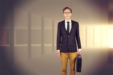 simsearch:400-08020381,k - Young geeky businessman holding briefcase against bright light in a curved room Fotografie stock - Microstock e Abbonamento, Codice: 400-08076533