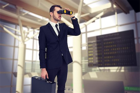 simsearch:400-08020381,k - Businessman holding a briefcase while using binoculars  against airport Fotografie stock - Microstock e Abbonamento, Codice: 400-08076571