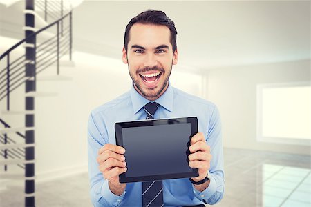 person on winding stairs - Happy businessman showing his tablet pc  against digitally generated room with winding stairs Stock Photo - Budget Royalty-Free & Subscription, Code: 400-08076581