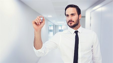 simsearch:6109-07497575,k - Focused businessman writing with marker against college hallway Foto de stock - Super Valor sin royalties y Suscripción, Código: 400-08076635