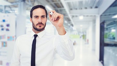 simsearch:6109-07497575,k - Focused businessman writing with marker against college hallway Foto de stock - Super Valor sin royalties y Suscripción, Código: 400-08076636