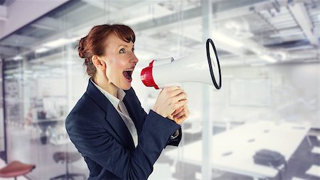Businesswoman with loudspeaker against classroom Stock Photo - Budget Royalty-Free & Subscription, Code: 400-08076660