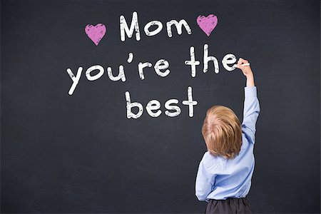 Cute pupil writing against black background Stock Photo - Budget Royalty-Free & Subscription, Code: 400-08076870