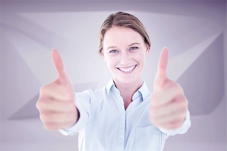 simsearch:400-06883455,k - Smiling businesswoman looking at camera against abstract grey room Photographie de stock - Aubaine LD & Abonnement, Code: 400-08076934