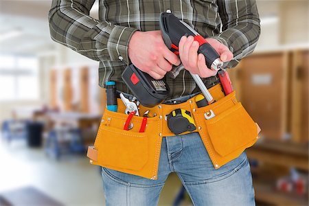 simsearch:400-08077176,k - Manual worker holding gloves and hammer power drill  against workshop Foto de stock - Super Valor sin royalties y Suscripción, Código: 400-08077049