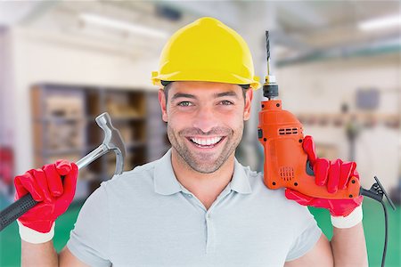 simsearch:400-08077176,k - Happy repairman holding hammer and drill machine against workshop Foto de stock - Super Valor sin royalties y Suscripción, Código: 400-08077058