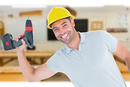 simsearch:400-08077176,k - Smiling repairman holding power drill against workshop Foto de stock - Super Valor sin royalties y Suscripción, Código: 400-08077060