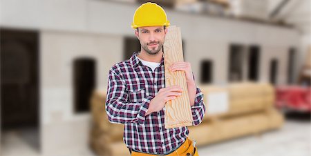 simsearch:400-08077074,k - Handyman holding wood planks against workshop Foto de stock - Super Valor sin royalties y Suscripción, Código: 400-08077074